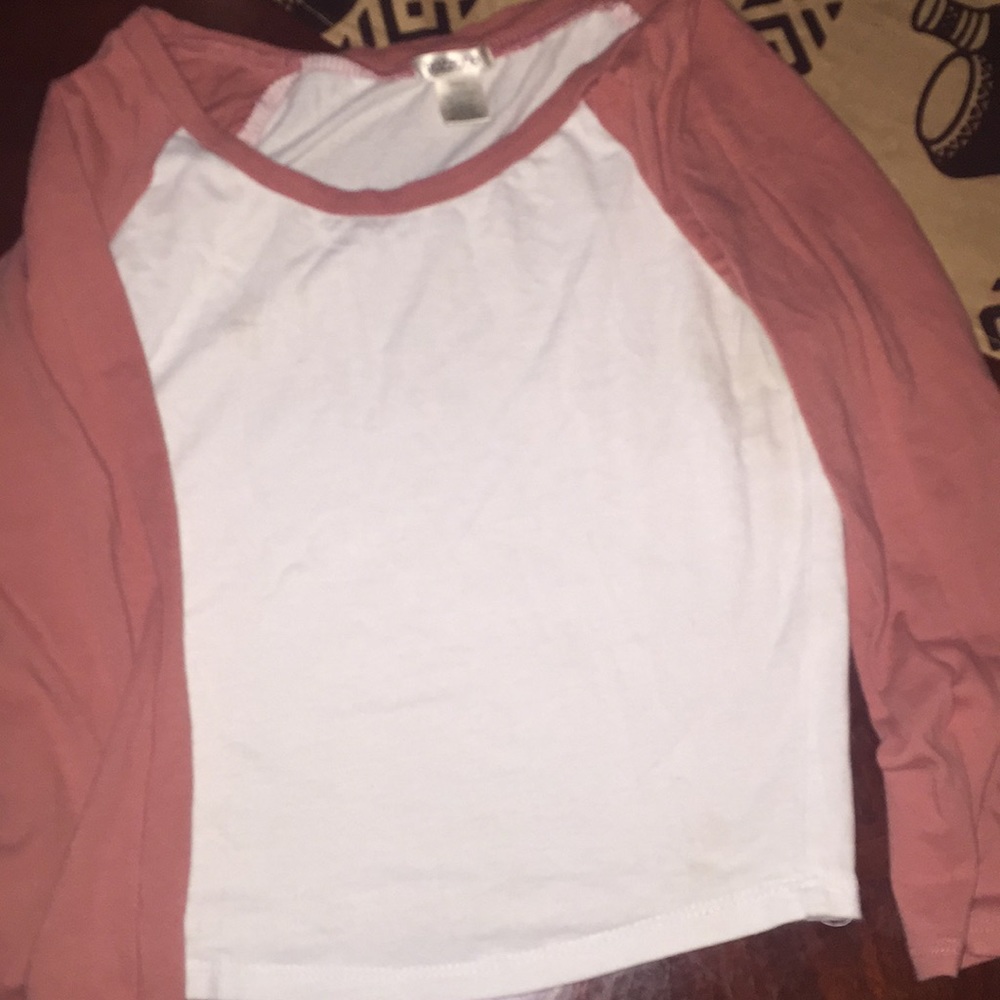 A white And nude colored baseball crop top